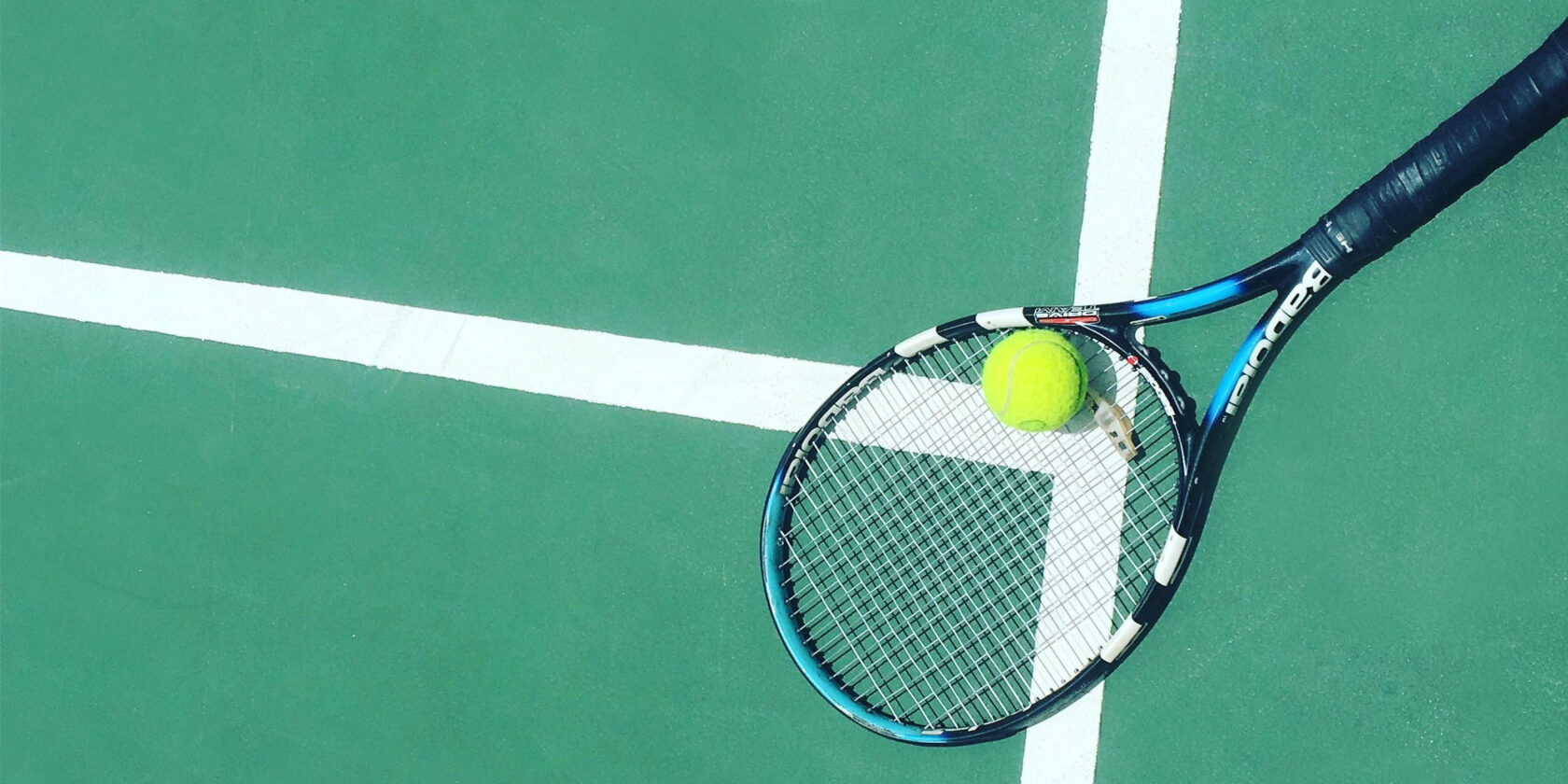 A tennis racket and ball.